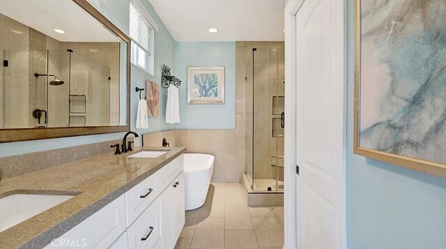 24965 Seagate, Dana Point, CA 92629 - full bath with a stall shower, a freestanding bath, double vanity, recessed lighting, and tile patterned floors