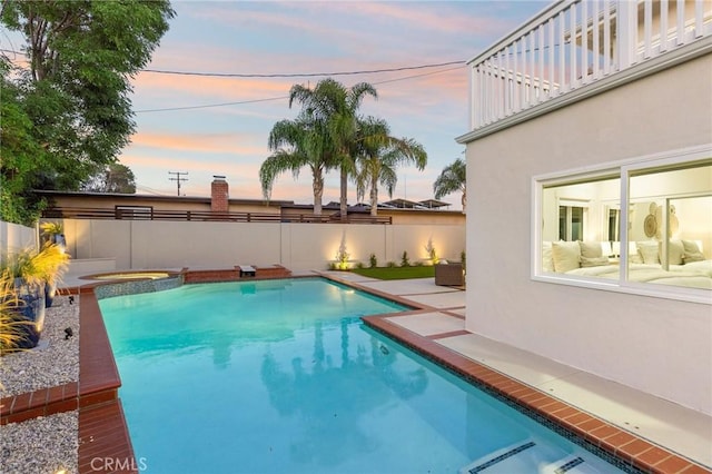 245 Surf Pl, Seal Beach, CA 90740 - pool at dusk with a patio area and a pool with connected hot tub