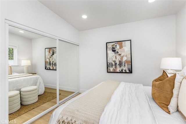245 Surf Pl, Seal Beach, CA 90740 - bedroom featuring recessed lighting, wood finished floors, and a closet
