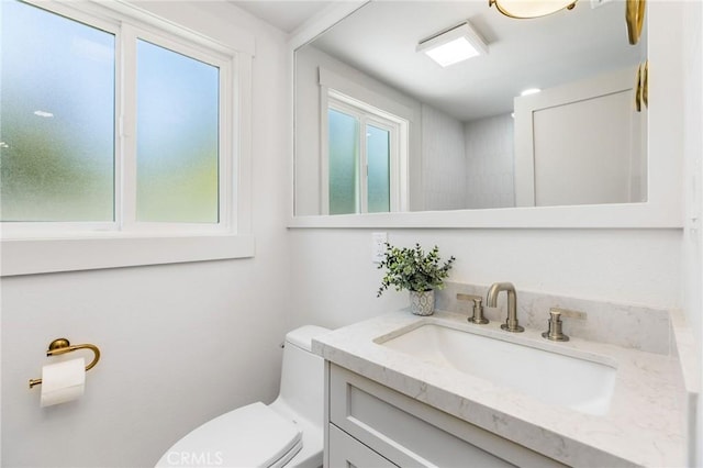 245 Surf Pl, Seal Beach, CA 90740 - half bathroom featuring vanity and healthy amount of natural light