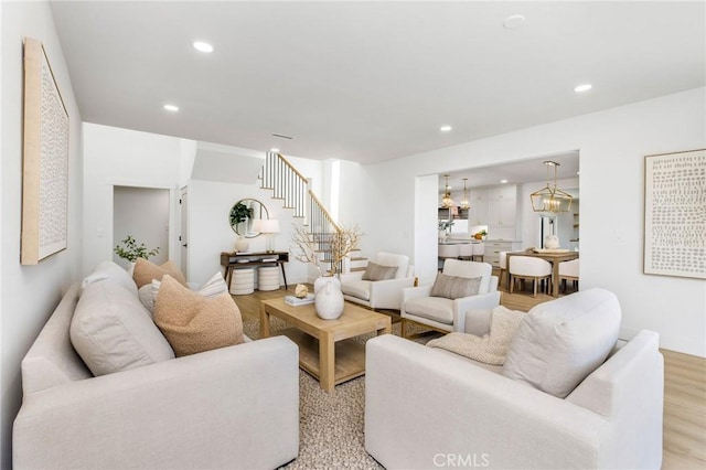 245 Surf Pl, Seal Beach, CA 90740 - living area with stairway, recessed lighting, and light wood-style flooring
