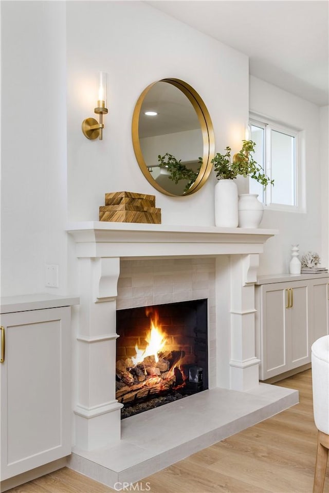 245 Surf Pl, Seal Beach, CA 90740 - detailed view of a tile fireplace and wood finished floors