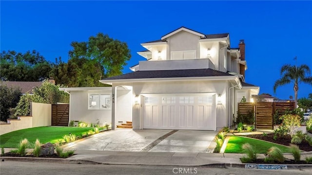 245 Surf Pl, Seal Beach, CA 90740 - contemporary house with stairway, concrete driveway, stucco siding, and a chimney
