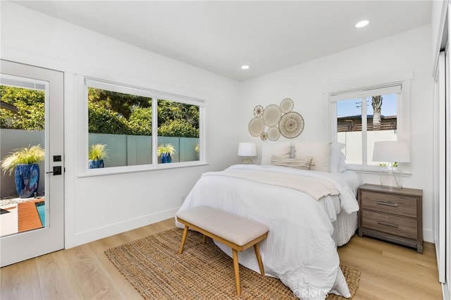 245 Surf Pl, Seal Beach, CA 90740 - bedroom with multiple windows, light wood-type flooring, and recessed lighting