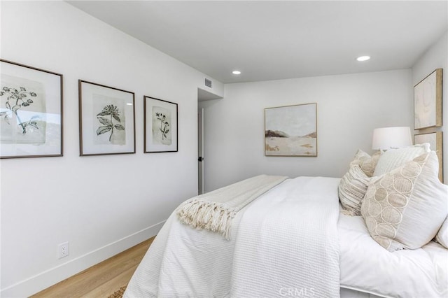 245 Surf Pl, Seal Beach, CA 90740 - bedroom with wood finished floors and recessed lighting