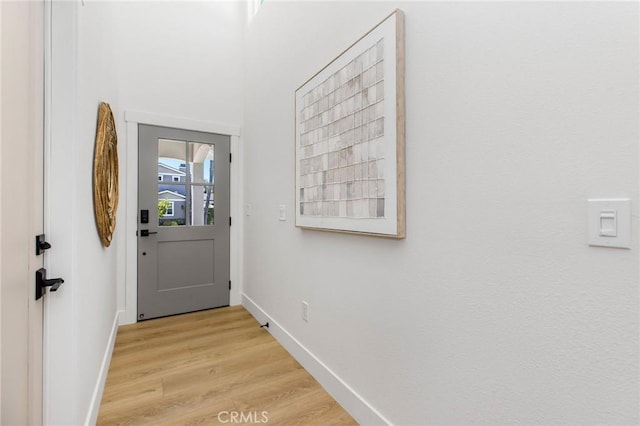 245 Surf Pl, Seal Beach, CA 90740 - doorway with light wood-type flooring and baseboards