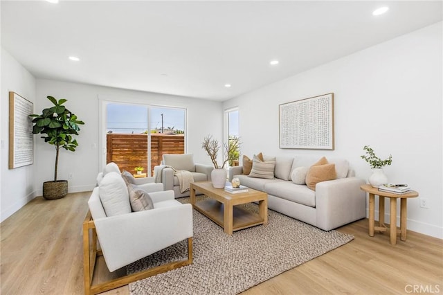 245 Surf Pl, Seal Beach, CA 90740 - living room with recessed lighting and light wood finished floors