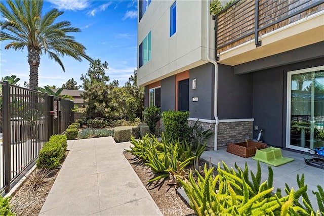 253 Steely, Irvine, CA 92614 - view of side of property with stucco siding and stone siding