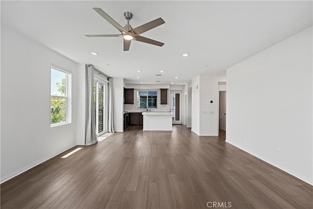 253 Steely, Irvine, CA 92614 - unfurnished living room with ceiling fan, dark wood-style floors, and recessed lighting