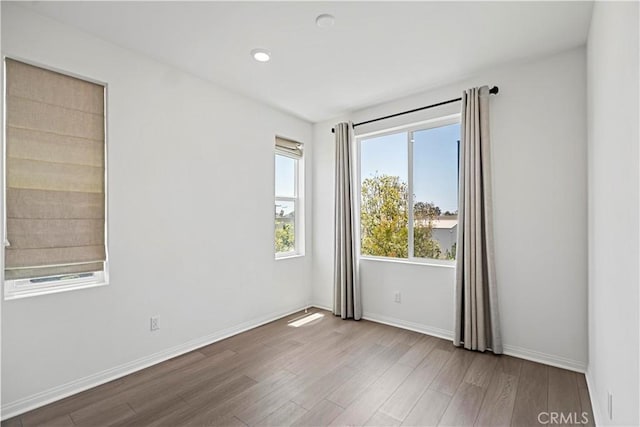 253 Steely, Irvine, CA 92614 - spare room with wood finished floors and baseboards