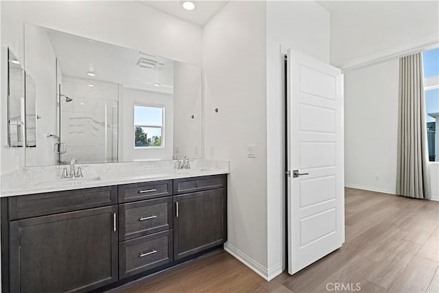 253 Steely, Irvine, CA 92614 - full bathroom featuring a stall shower, double vanity, wood finished floors, and recessed lighting
