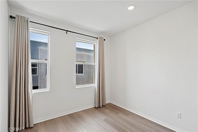 253 Steely, Irvine, CA 92614 - spare room featuring light wood-style flooring and baseboards
