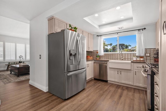 2046 Ups Cir, Oceanside, CA 92054 - kitchen featuring appliances with stainless steel finishes, dark wood-type flooring, tasteful backsplash, and recessed lighting