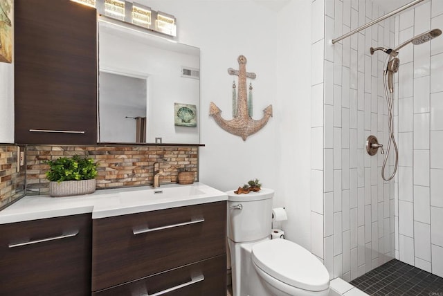 2046 Ups Cir, Oceanside, CA 92054 - full bathroom with vanity, tasteful backsplash, and tiled shower