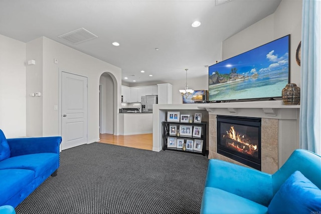 835 Harbor Cliff Way Unit 286, Oceanside, CA 92054 - carpeted living area with a fireplace, recessed lighting, and a chandelier