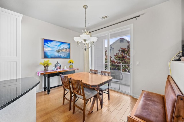 835 Harbor Cliff Way Unit 286, Oceanside, CA 92054 - dining area featuring a chandelier and light wood-style flooring
