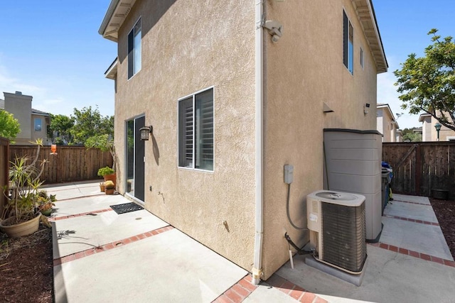 210 Belflora Way, Oceanside, CA 92057 - view of home's exterior featuring stucco siding, a fenced backyard, and a patio