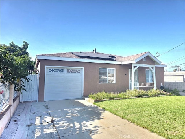 12157 Nava St, Norwalk, CA 90650 - ranch-style house with stucco siding, a garage, driveway, and solar panels