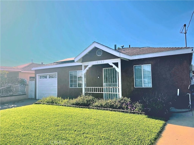 12157 Nava St, Norwalk, CA 90650 - ranch-style home with a front lawn, a garage, and stucco siding