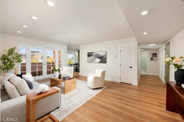 1010 Palm Ave Unit 207, West Hollywood, CA 90069 - living area with french doors, light wood-style flooring, and recessed lighting