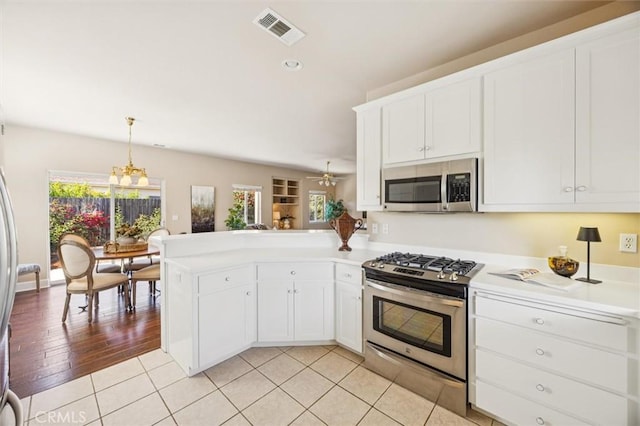 1432 Blackberry Ave, Arroyo Grande, CA 93420 - kitchen with appliances with stainless steel finishes, healthy amount of natural light, a peninsula, light countertops, and recessed lighting