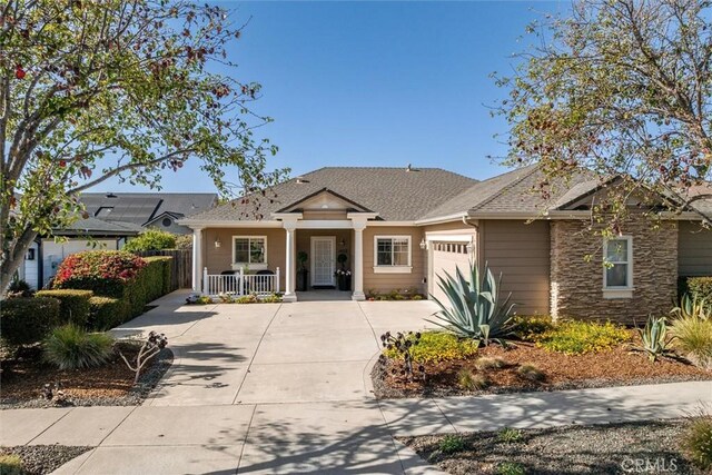 1432 Blackberry Ave, Arroyo Grande, CA 93420 - view of front facade featuring a porch, a garage, concrete driveway, and stone siding