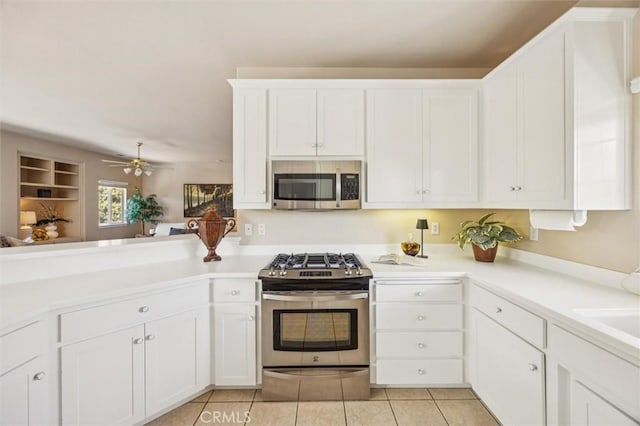1432 Blackberry Ave, Arroyo Grande, CA 93420 - kitchen with appliances with stainless steel finishes, light tile patterned floors, light countertops, and white cabinets
