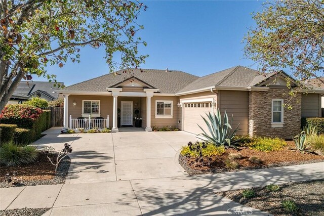 1432 Blackberry Ave, Arroyo Grande, CA 93420 - view of front of property with a porch, an attached garage, concrete driveway, and stone siding