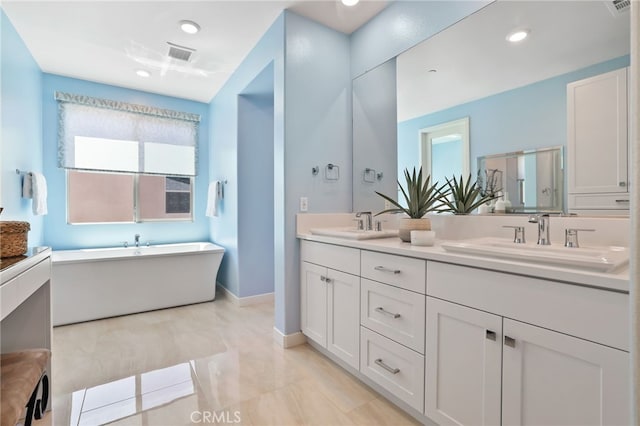 133 Denali, Lake Forest, CA 92630 - bathroom with double vanity, a freestanding bath, recessed lighting, and tile patterned flooring