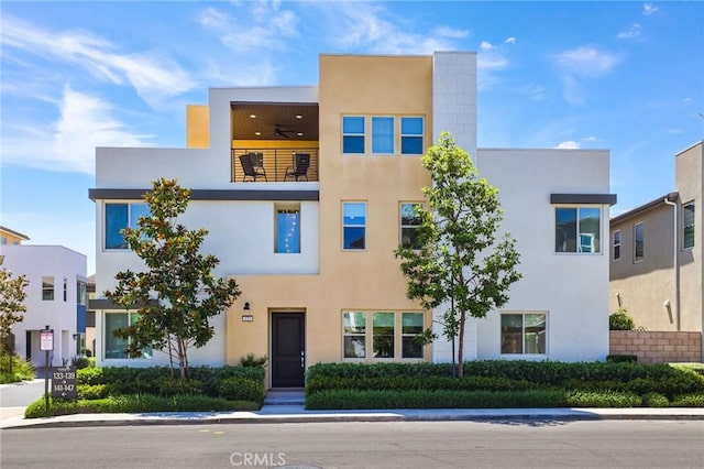 133 Denali, Lake Forest, CA 92630 - view of front facade featuring a ceiling fan, stucco siding, and a balcony