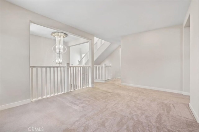 133 Denali, Lake Forest, CA 92630 - spare room with carpet flooring and a chandelier