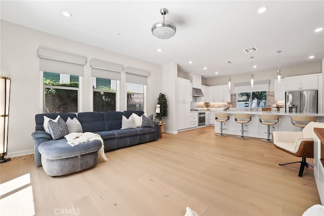 133 Denali, Lake Forest, CA 92630 - living room featuring light wood finished floors and recessed lighting