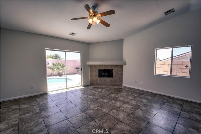 9464 Palm Dr, Desert Hot Springs, CA 92240 - unfurnished living room featuring ceiling fan and a fireplace