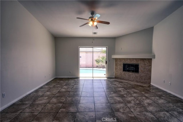 9464 Palm Dr, Desert Hot Springs, CA 92240 - unfurnished living room featuring a ceiling fan and a tiled fireplace