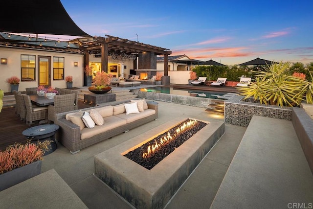 15614 S Chevy Chase, San Diego, CA 92127 - patio terrace at dusk featuring a patio, an outdoor living space with a fire pit, outdoor dining space, and a pergola