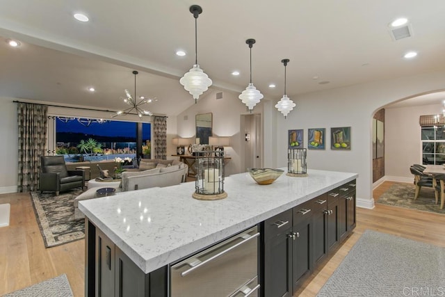 15614 S Chevy Chase, San Diego, CA 92127 - kitchen with arched walkways, light wood finished floors, a kitchen island, lofted ceiling, and pendant lighting