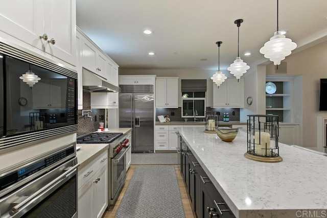 15614 S Chevy Chase, San Diego, CA 92127 - kitchen with built in appliances, white cabinetry, tasteful backsplash, a spacious island, and recessed lighting