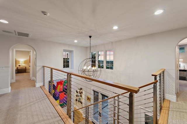 15614 S Chevy Chase, San Diego, CA 92127 - hall with arched walkways, an upstairs landing, a chandelier, recessed lighting, and carpet floors