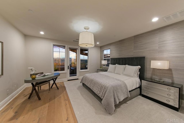 15614 S Chevy Chase, San Diego, CA 92127 - bedroom with recessed lighting, light wood-style flooring, access to exterior, and an accent wall