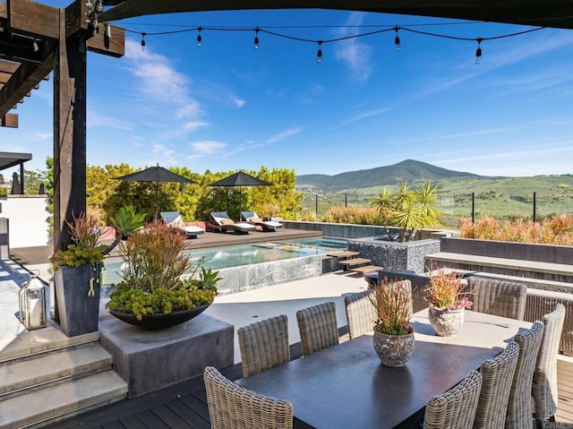 15614 S Chevy Chase, San Diego, CA 92127 - deck with outdoor dining space, a mountain view, an infinity pool, and a patio area