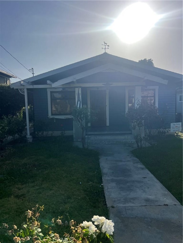 150 N Cambridge St, Orange, CA 92866 - view of front of home featuring covered porch and a front lawn