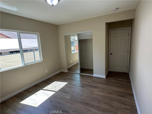 841 W 17th St, San Bernardino, CA 92405 - unfurnished bedroom with wood finished floors and a closet
