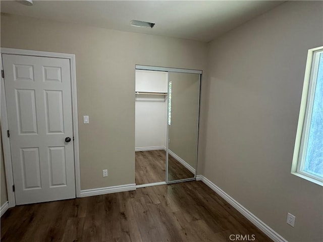 841 W 17th St, San Bernardino, CA 92405 - unfurnished bedroom with wood finished floors and a closet