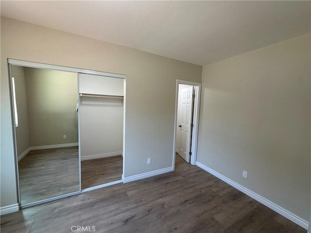 841 W 17th St, San Bernardino, CA 92405 - unfurnished bedroom with wood finished floors and a closet