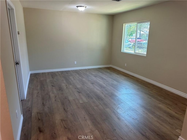 841 W 17th St, San Bernardino, CA 92405 - spare room with wood finished floors and baseboards