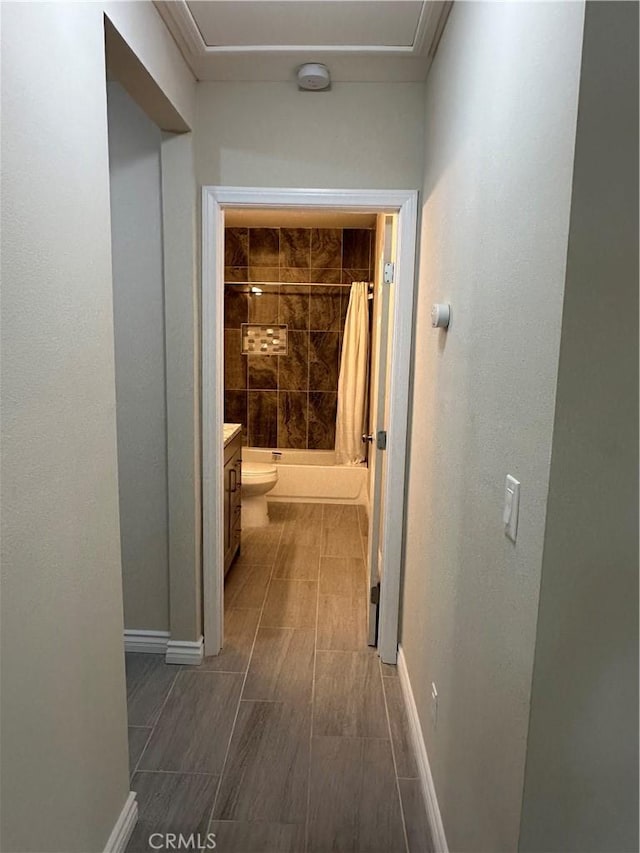 841 W 17th St, San Bernardino, CA 92405 - corridor featuring baseboards and wood finish floors