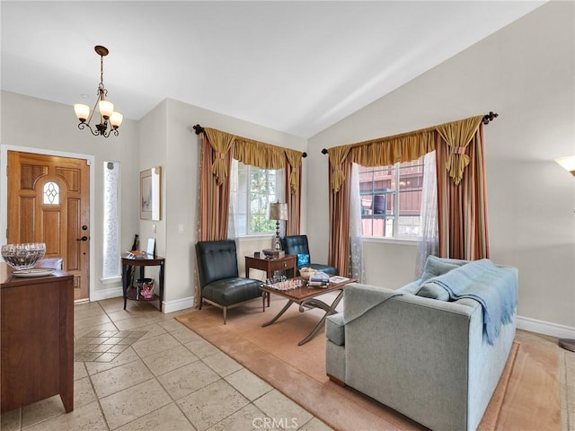 13906 Lexicon Ave, Sylmar, CA 91342 - living room featuring vaulted ceiling, a chandelier, and stone tile floors