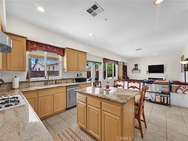 13906 Lexicon Ave, Sylmar, CA 91342 - kitchen with stainless steel dishwasher, white gas stovetop, a center island, recessed lighting, and light stone counters