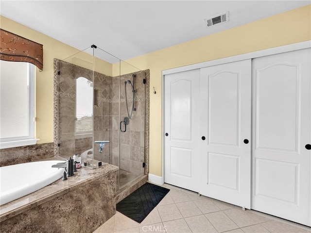 13906 Lexicon Ave, Sylmar, CA 91342 - full bathroom featuring tile patterned flooring, a garden tub, and a shower stall