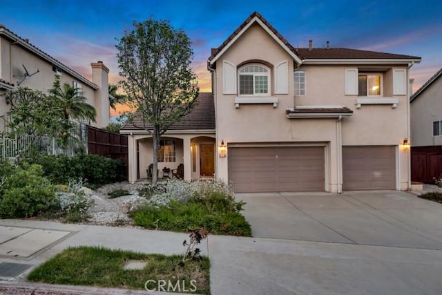 13906 Lexicon Ave, Sylmar, CA 91342 - traditional home with an attached garage, stucco siding, and driveway